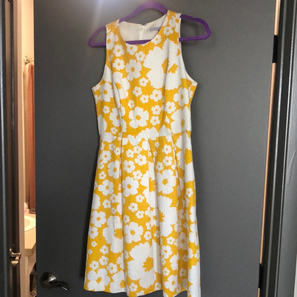 Carmen Marco Valvo dress..Yellow w/flowers. Pockets. Zip back, pleated skirt.